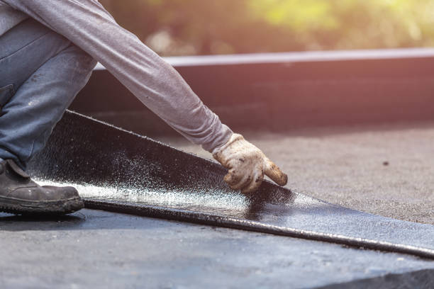 Professional Basement Waterproofing technician working in Johnson City, KS